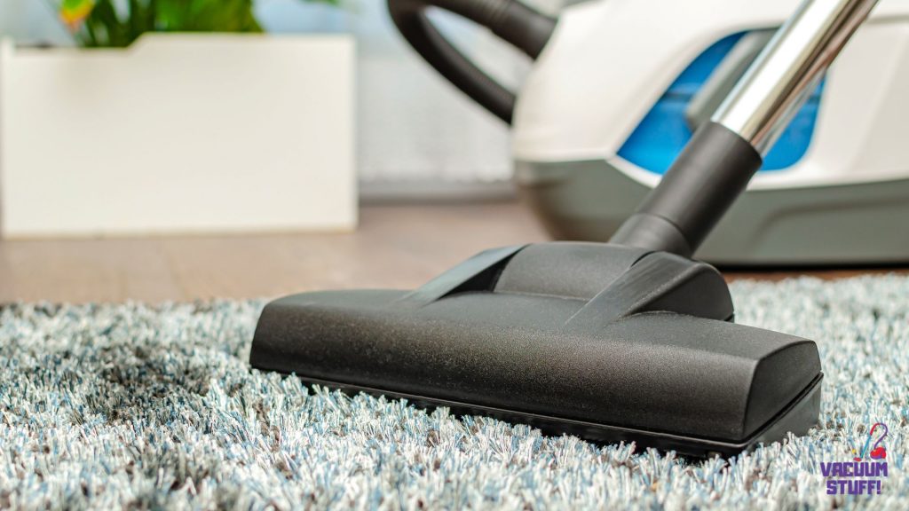 Photo of vacuum cleaning carpet