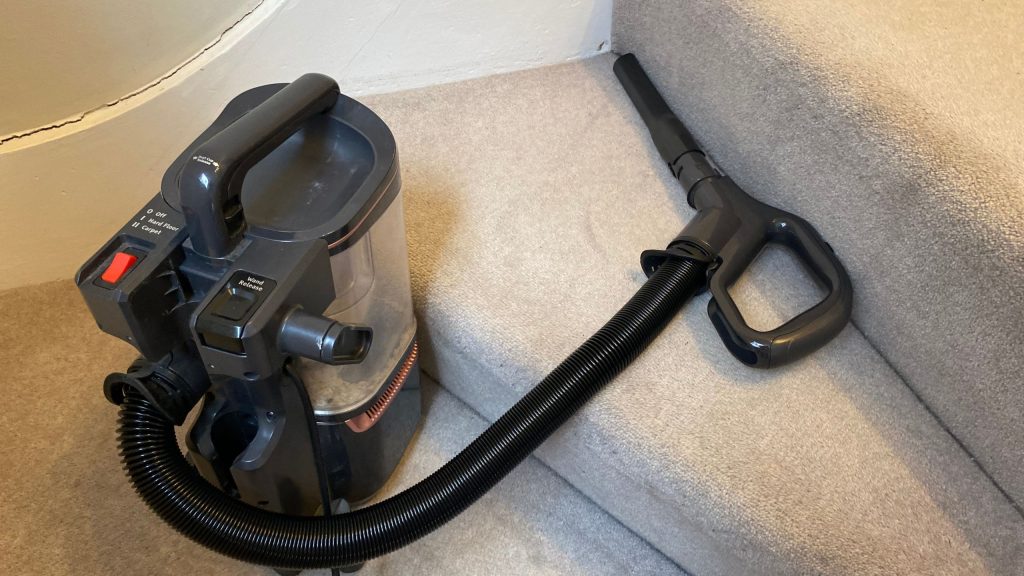 Why do people need vacuum cleaners? Picture of vacuum on stairs